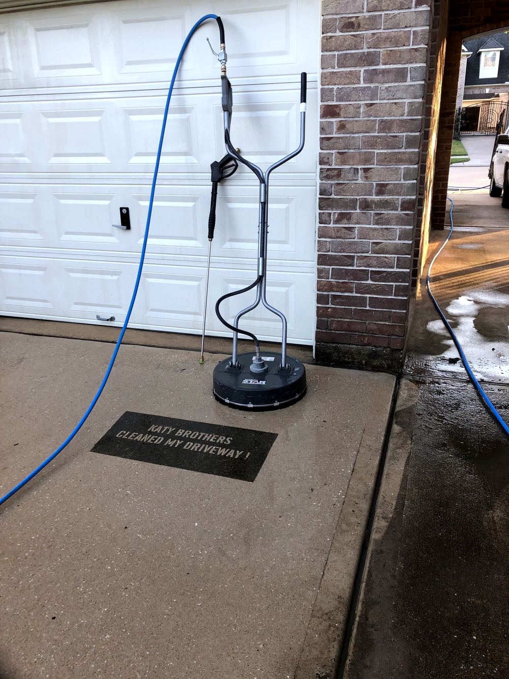 Surface cleaner on a new-build driveway, Katy Brothers Pressure Washing